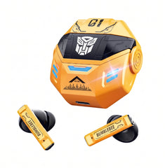 A pair of yellow and black wireless earbuds with a matching yellow charging case, featuring a stylized Decepticon-inspired design with the Autobot logo and the word 'BUMBLEBEE' on the earbuds, shown on a plain white background.