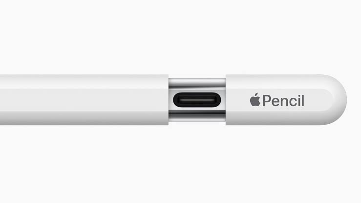 A close-up of a white Apple Pencil showing the center section with a USB-C connector and the Apple Pencil logo on the cap, set against a plain white background.